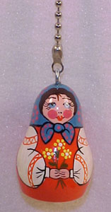 fan pulls: small russian figurine doll with silver pull chain.