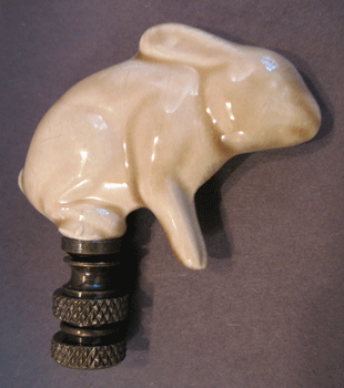 Finial:  Ceramic Rabbit. . 2 1/2" overall
