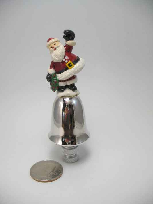 Santa Sitting on a Small Bell