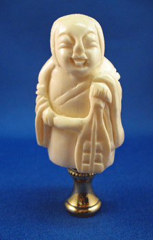 Finial: Bone Musician Figure. 3" overall